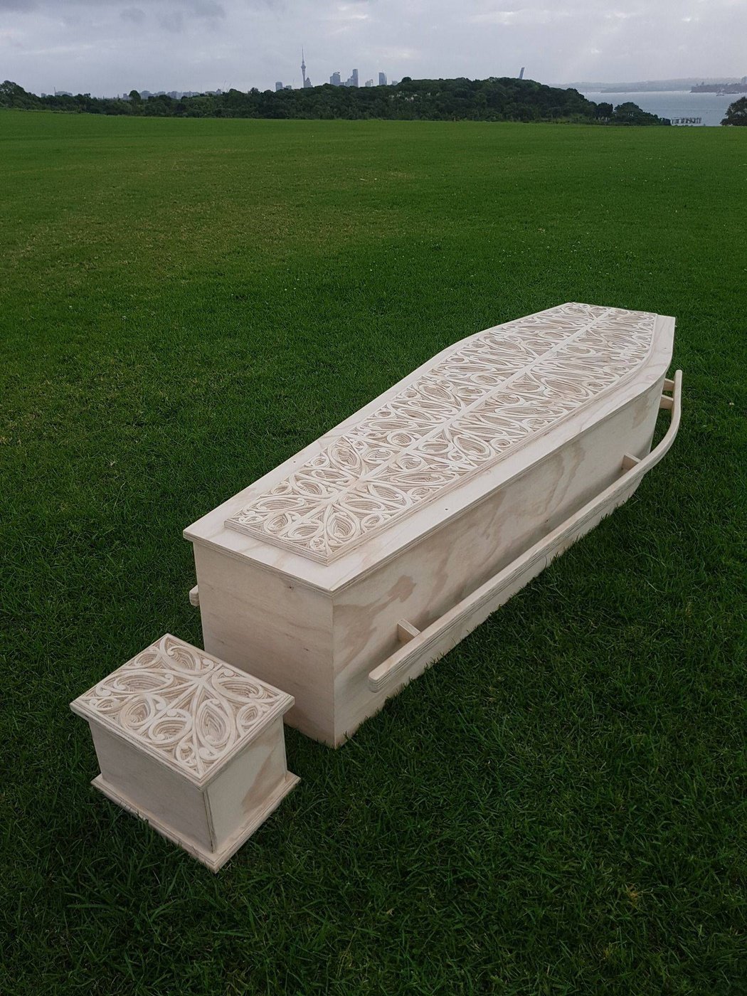 Korowai - Casket and URN on lawn